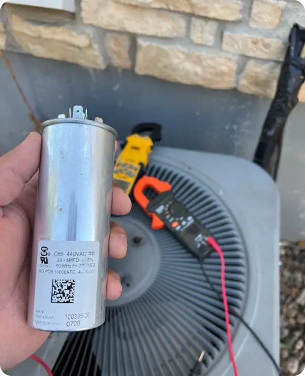 Person holding a piece of AC