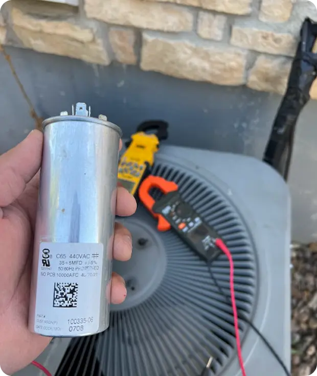 Person holding a piece of AC