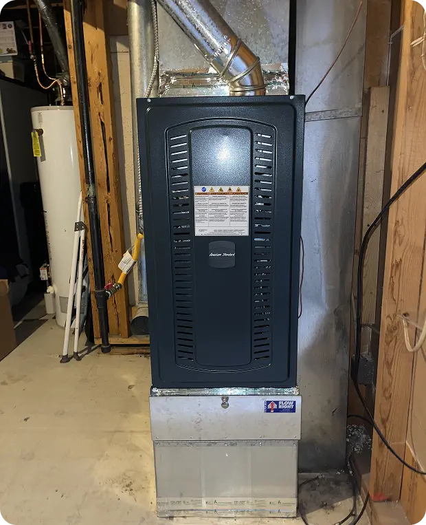 Residential heating furnace installed and connected to ventilation ducts